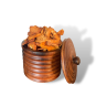 Kaki séché en tranches provenant de Madagascar, dans un pot en bois